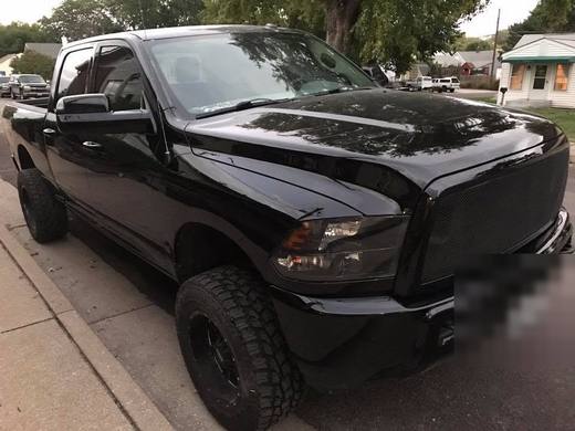 A black Ram with front-end damage
