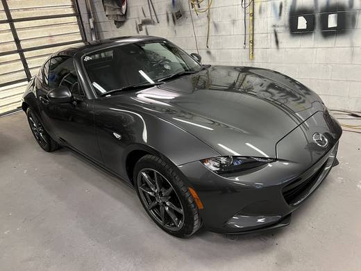 A dark gray Miata RF